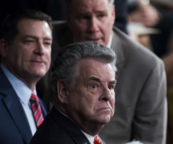 peter king looks to his right with a look of surprise