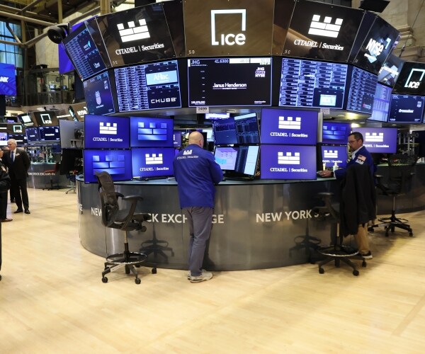 traders work on the floor of the new york stock exchange during morning trading 