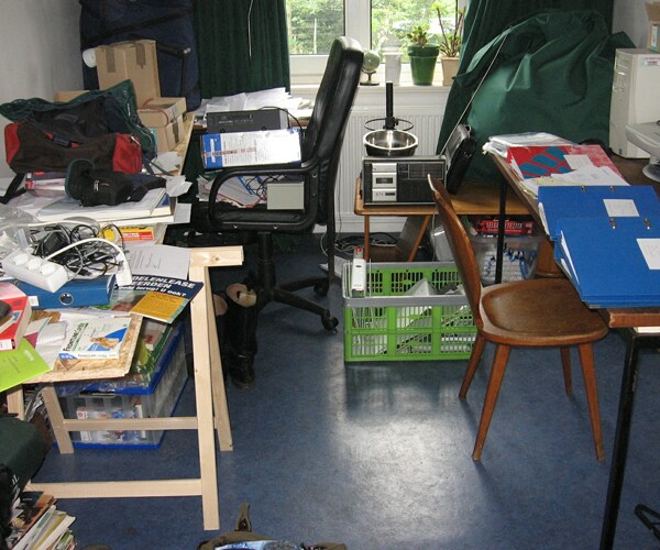 a room in a home filled with clutter