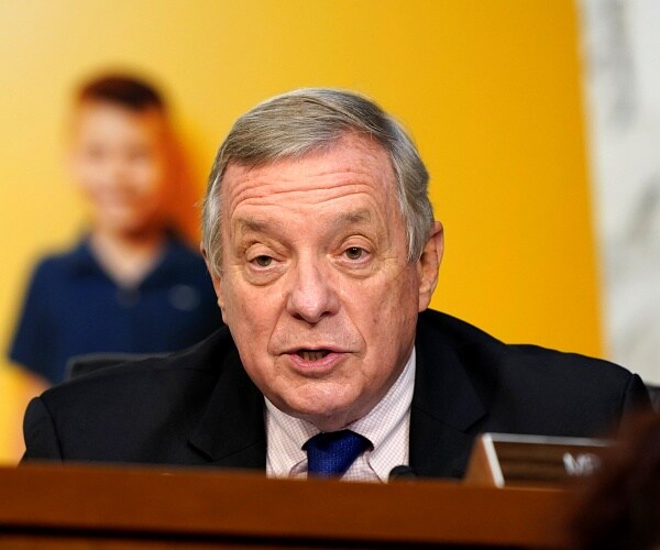 dick durbin speaks into microphone