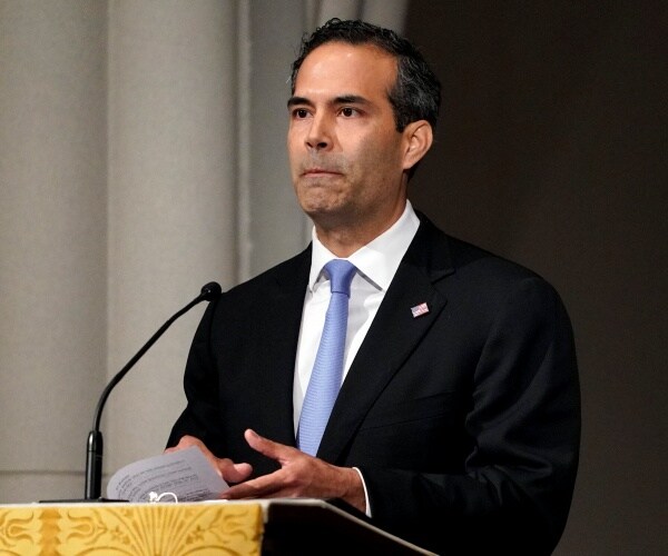 george p. bush gives a eulogy at a funeral