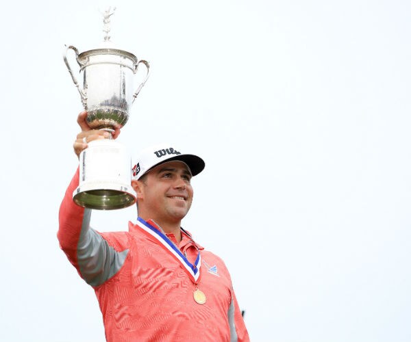 woodland holds up the trophy