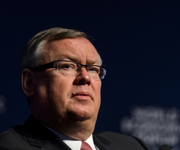 kostin in a suit at a world economic forum event
