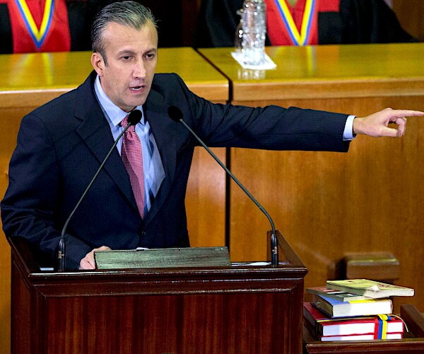 Tareck el Aissami points during a political speech