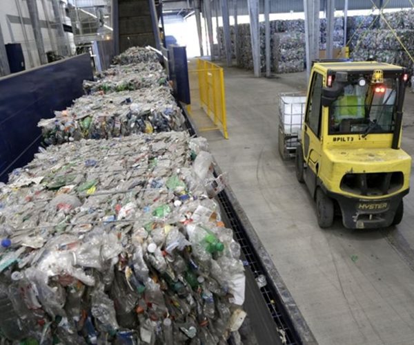 a forklift moving cargo inside a factory