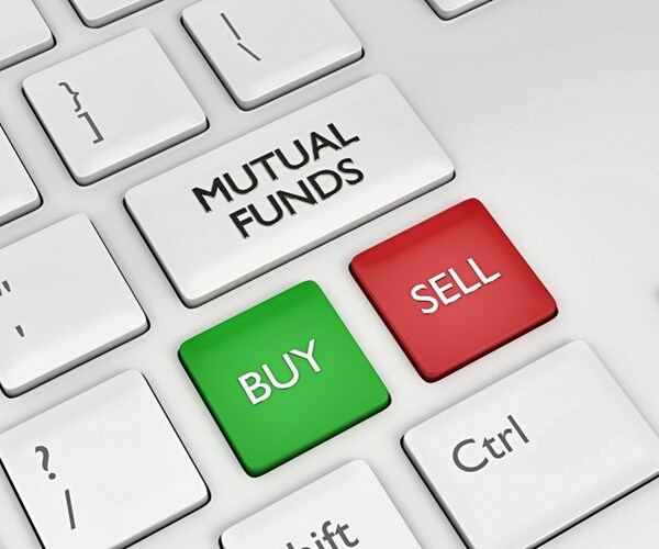 computer keyboard with mutual funds button with green buy button and red sell button

