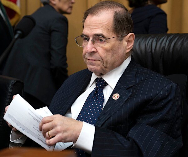 jerrold nadler opens mail while seated on the bench during a house hearing