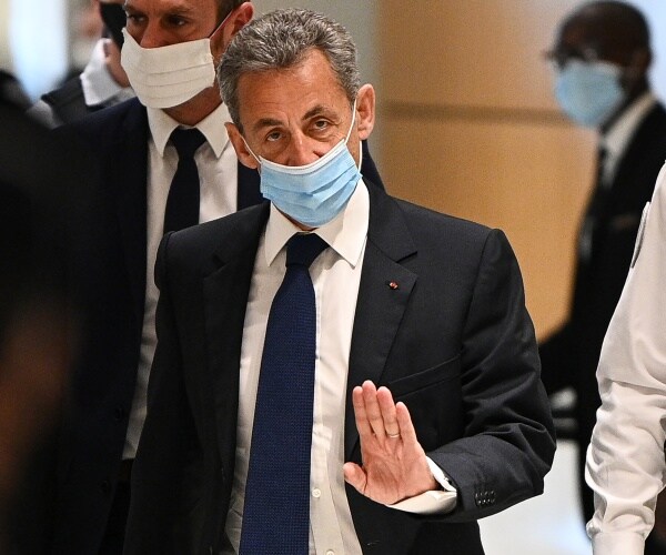 Former French president Nicolas Sarkozy arrives at the Paris court house