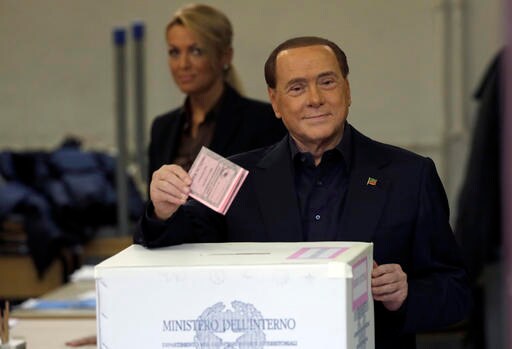 The Latest: Renzi Votes in Italy with Future on the Line
