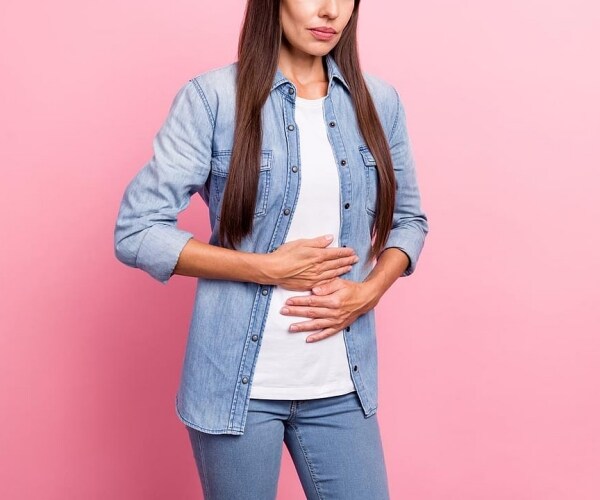 a woman holding her stomach