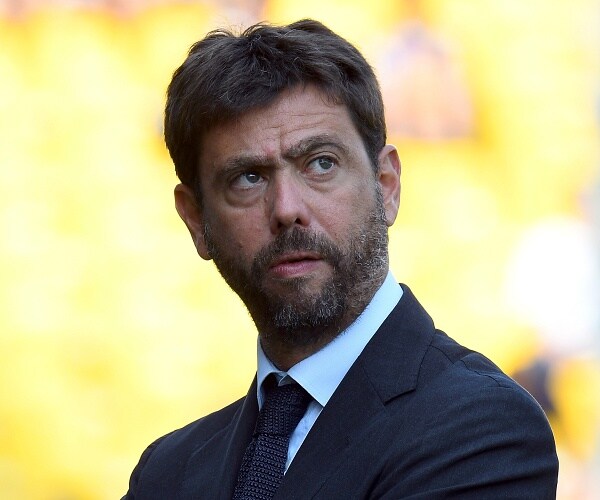 andrea agnelli stands in soccer stadium