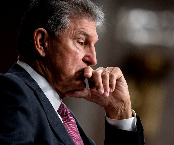 joe manchin sits in hearing