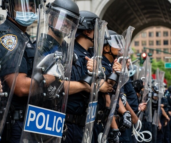 nypd officers line up with shields