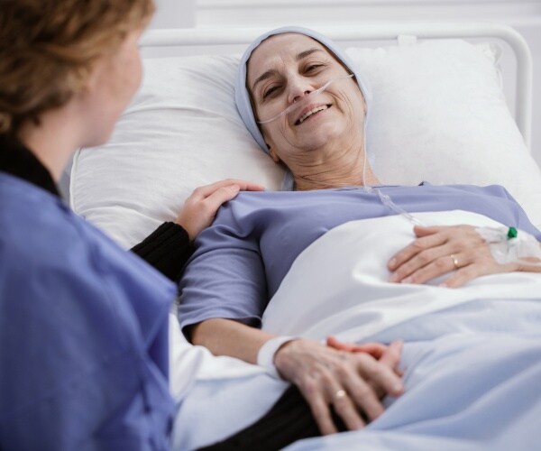 woman with leukemia being taken care of in a hospital