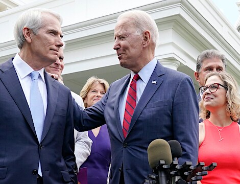 rob portman shares smiles with president joe biden