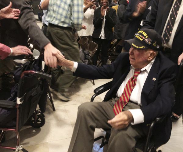 william pollard acknowledges the crowd in the kentucky capitol.