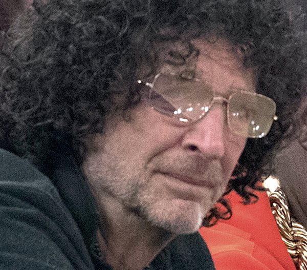 howard stern wears big hair and glasses