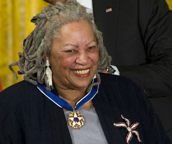 Toni Morrison wearing her signature gray dreadlocks, receives her medal of freedom award at the white house in 2012