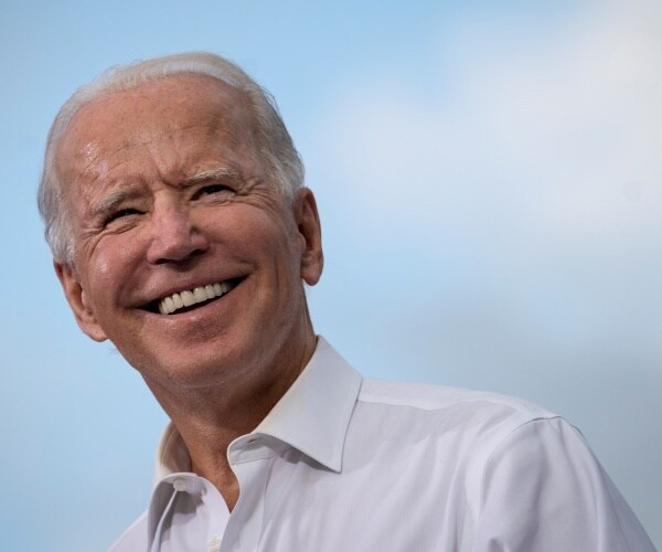 joe biden speaks and smiles