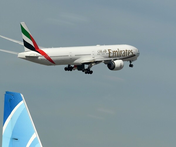 an emirates aircraft takes off from dubai