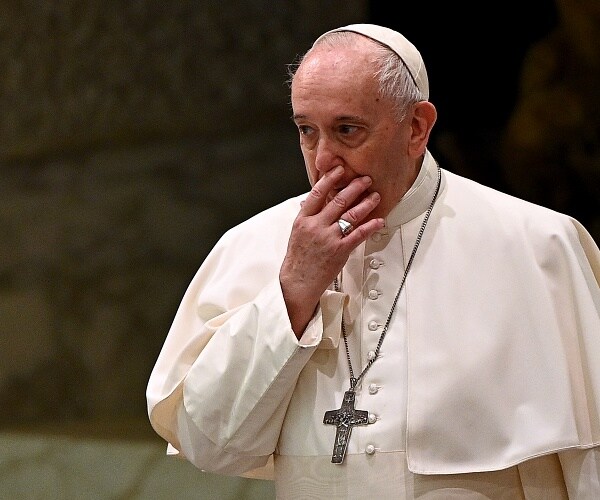 pope francis holds hand over mouth