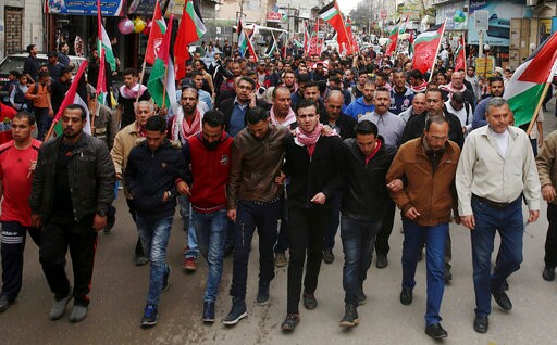 The Latest: Gaza Officials Say Palestinian Protester Killed