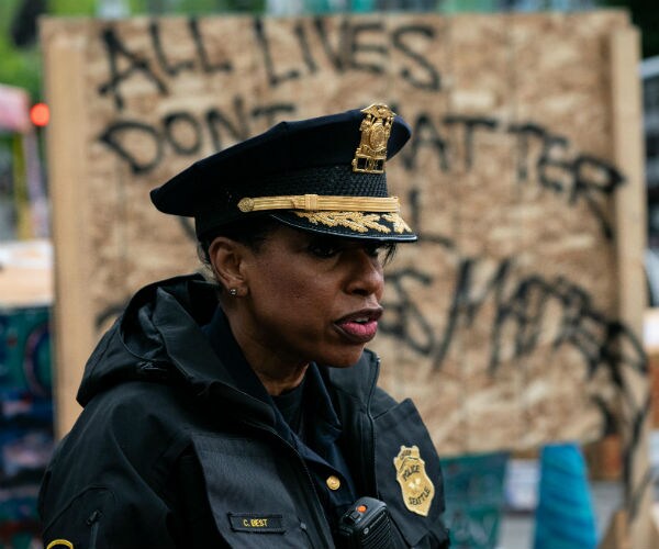 Seattle Police Chief Carmen Best addresses the press in her uniform