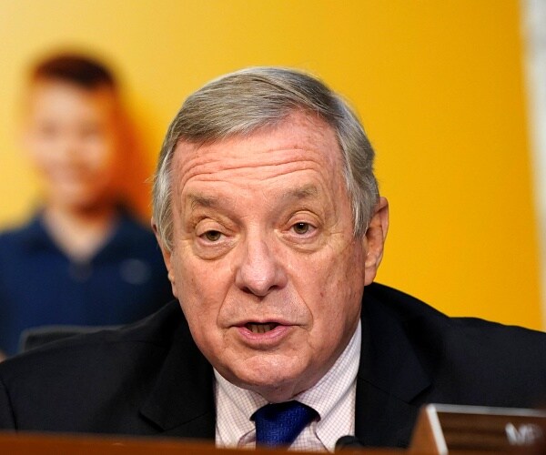 dick durbin speaks into microphone