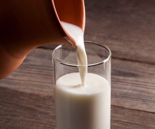 milk is poured into a glass