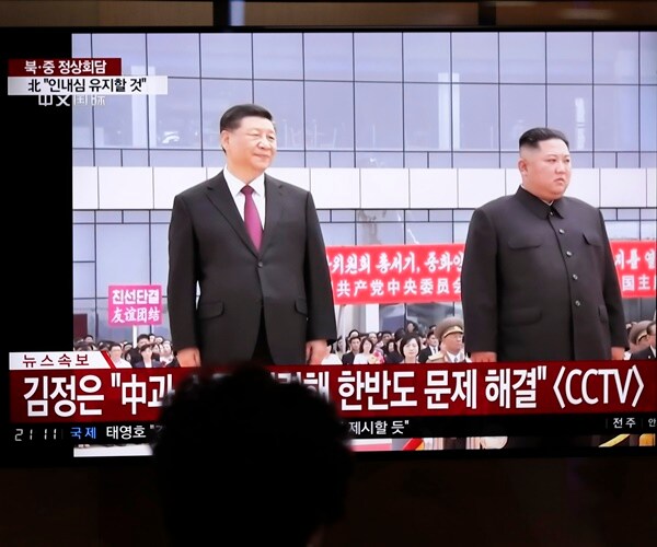 North Korea's Kim Meets China's Xi, Says Awaiting US Actions