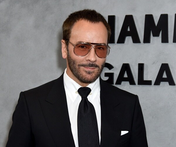 tom ford stands on red carpet