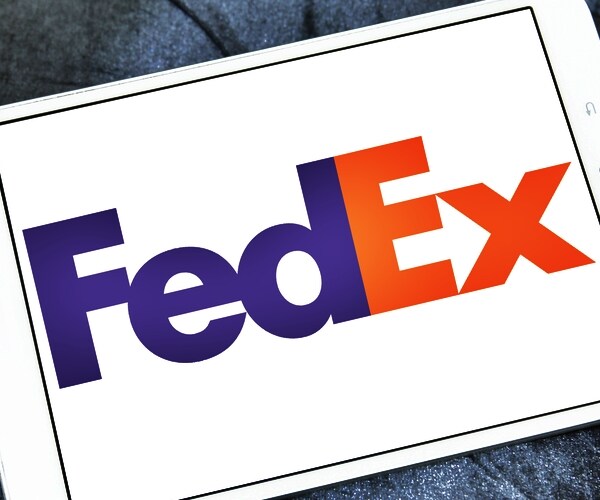 fedex corporate logo symbol emblem on computer pad screen
