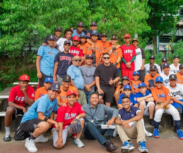 ray negron of the new york yankees with youth he coaches during the summer  