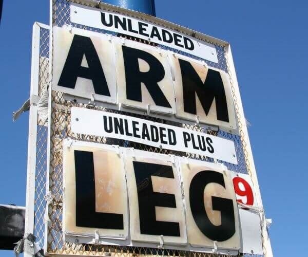 arm and a leg gas station sign