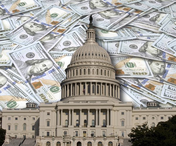 The U.S. Capitol superimposed on a bed of currency.