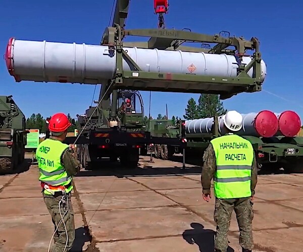 Russian military loads a missile into S-300 air defense missile system during exercises of the Air Defence Forces