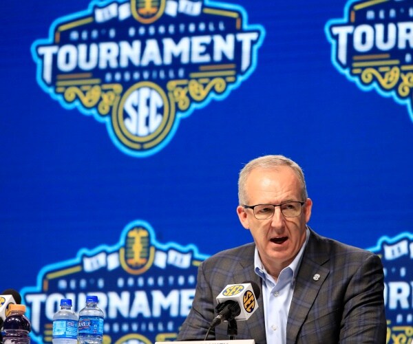 sankey in a gray plaid suit and light blue shirt