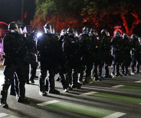police form a line in peninsula park in portland, oregon