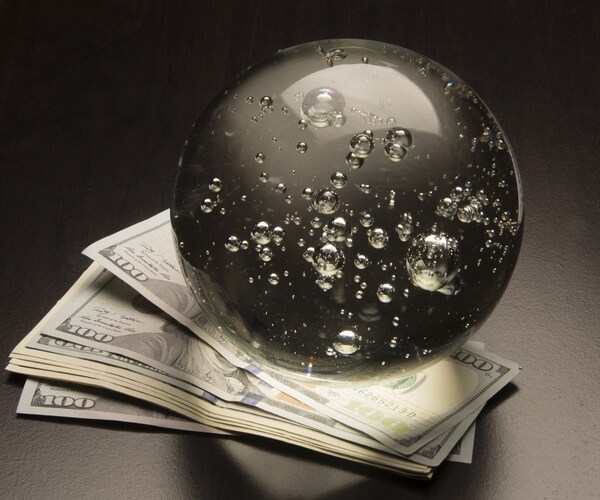 crystal ball and money on a black background 