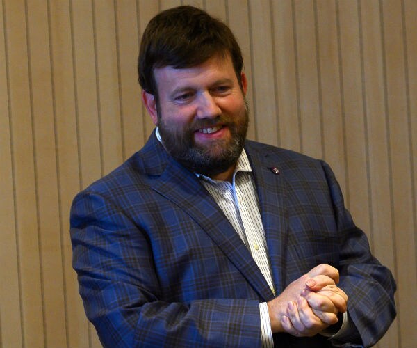 Frank Luntz  is shown speaking to students
