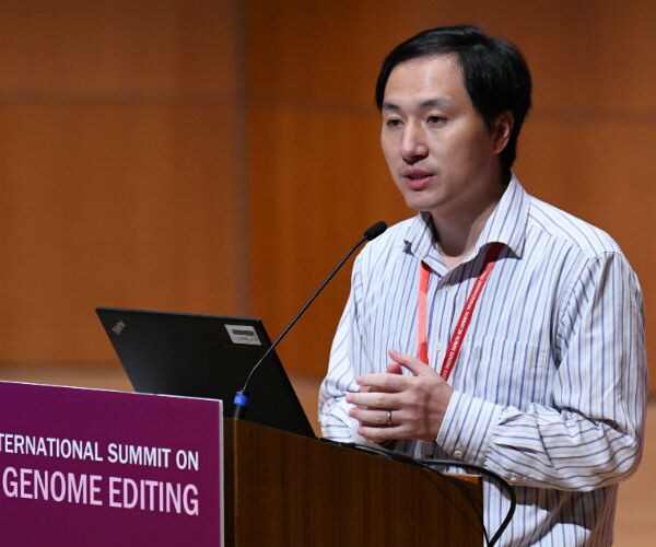 researcher he jiankui speaks during a conference 