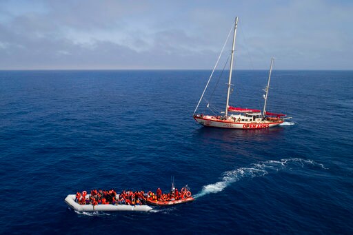 The Latest: Migrants Head to Italy after Standoff