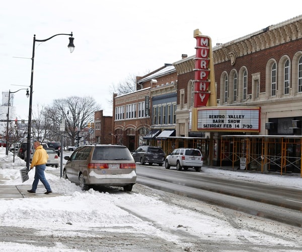 a snowy street scene in rural ohio