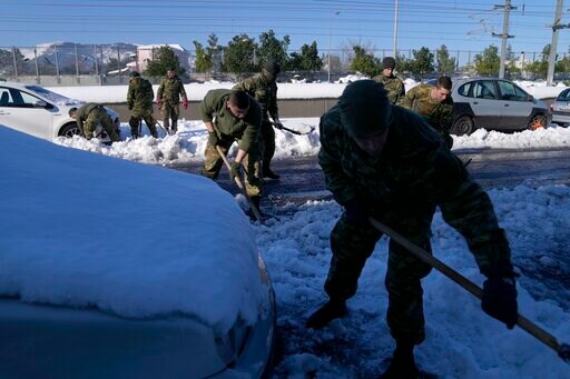 Greek Army Helps Remove Vehicles on Snow-plagued Road