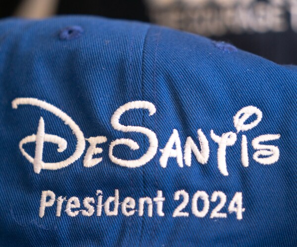 a ballcap reading desantis president twenty twenty four written in disney style