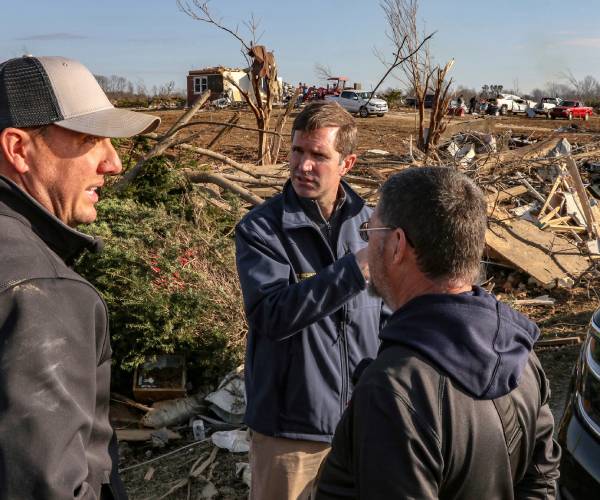 people touring tornado destruction