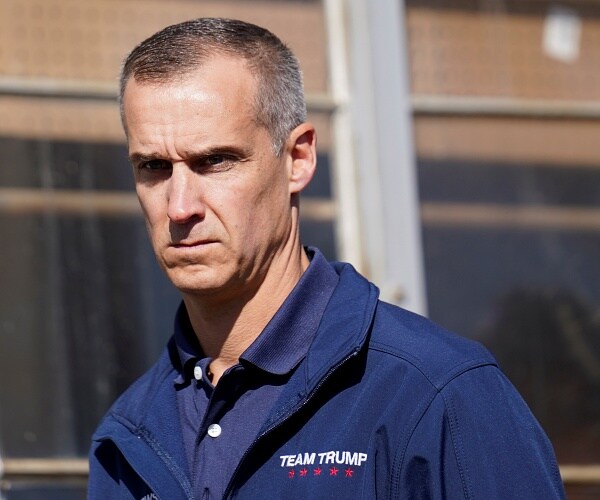 corey lewandowski stands outside