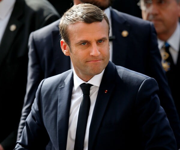 With Merkel and PM, France's New President Wastes no Time