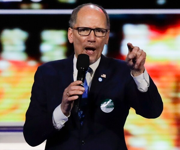 tom perez speaks from stage before a democratic primary debate