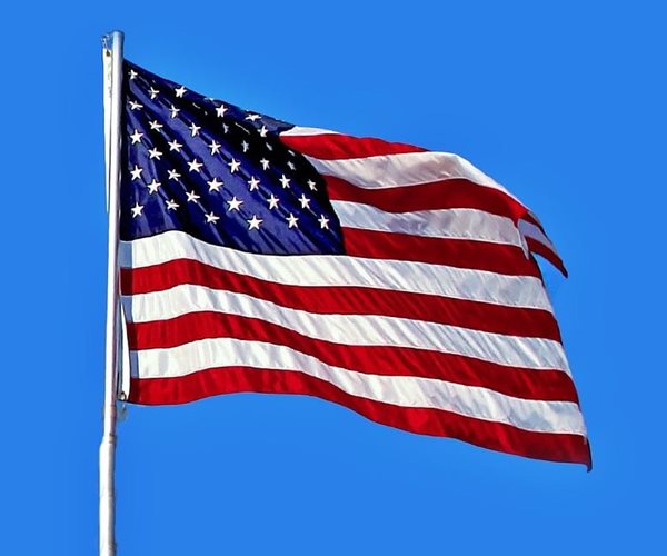 US Flags Strewn among Trash at Veteran's Memorial Cemetery